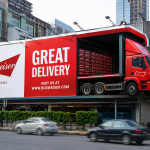 Creative Budweiser outdoor billboard campaign featuring a giant delivery truck integrated into a large urban hoarding to promote the “Great Delivery” campaign.